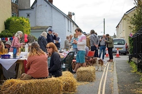 a photo of a street party in a devon village