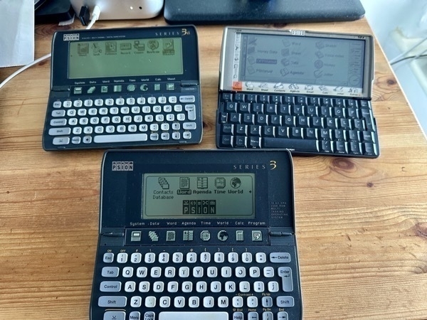 a photo of three Psion handheld computers